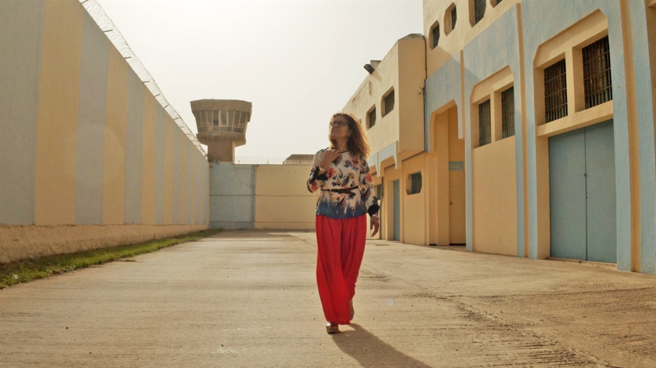 Fatna El Bouih stands in a prison yard